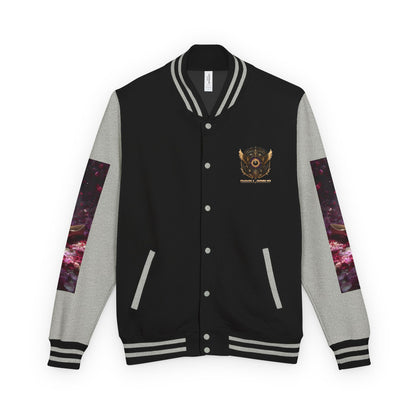 A varsity-style jacket with a black body, gray sleeves, and a small gold emblem on the left chest. The sleeves feature a purple and pink galaxy print, and the jacket is shown against a plain white background.