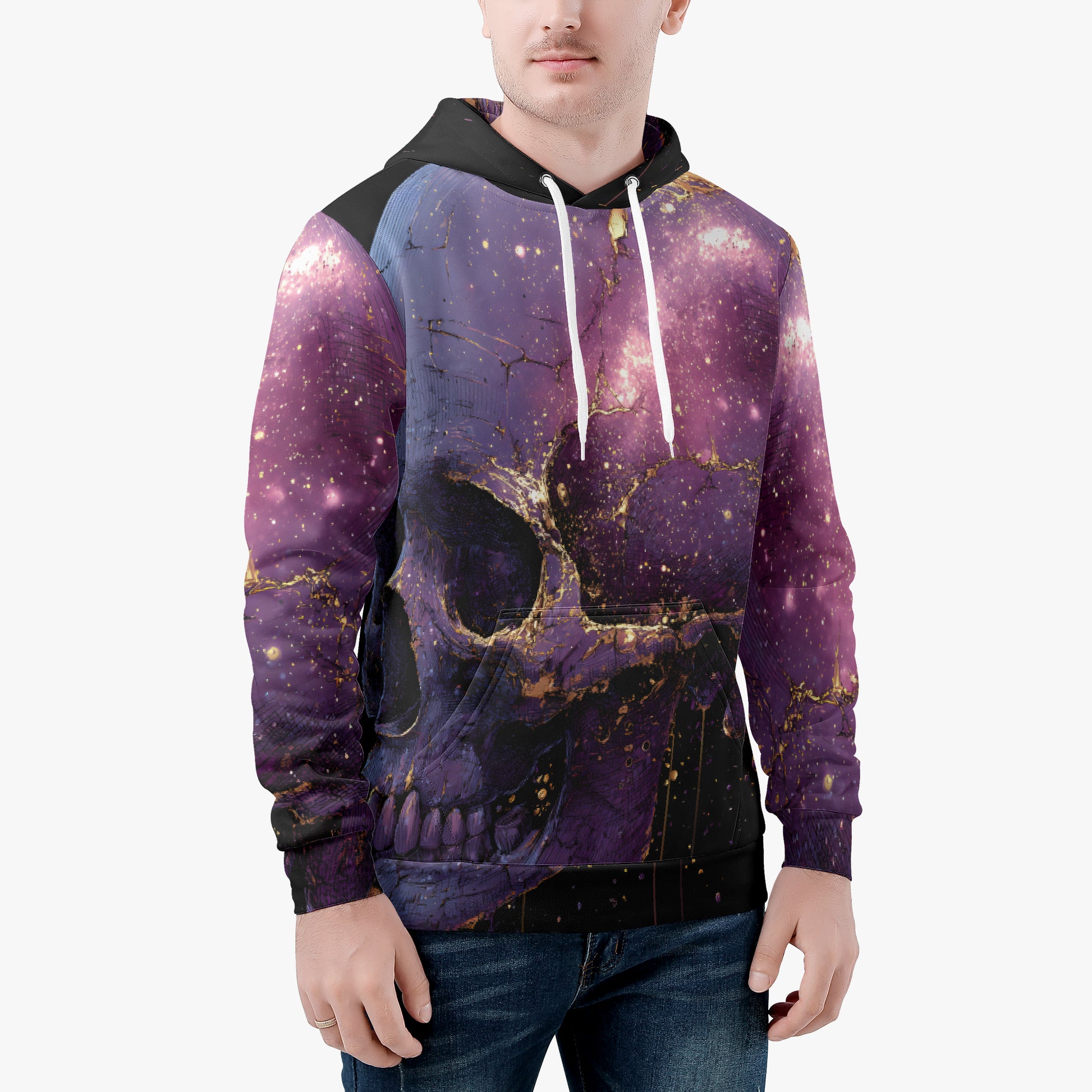 A man wearing a purple and black hoodie with a gold skull print and a galaxy pattern, paired with blue jeans, against a plain white background.