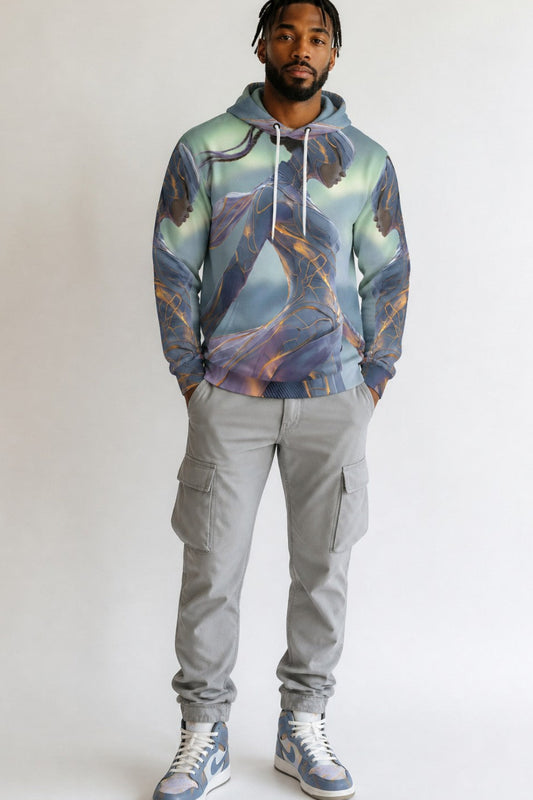 A man modeling a light blue and purple abstract-patterned hoodie, paired with gray cargo pants and blue and white sneakers, standing against a plain light gray background.