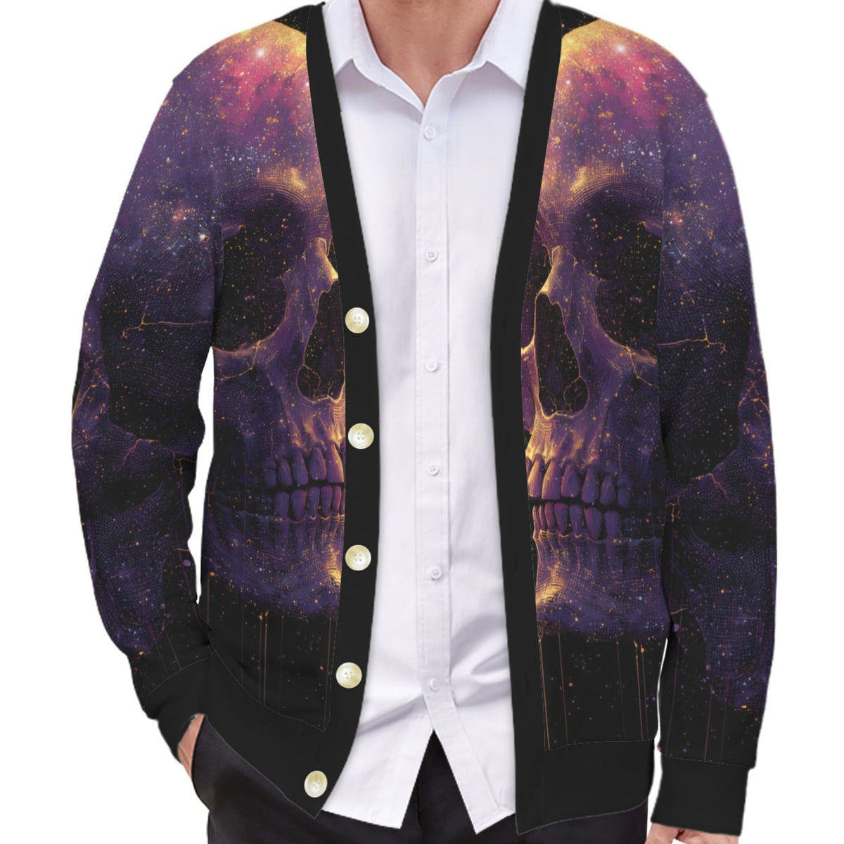 A man wearing a black button-front cardigan with a detailed purple, black, and orange cosmic skull print, layered over a white button-down shirt.