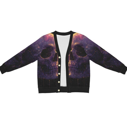 A black cardigan jacket featuring a detailed graphic print of two large skulls set against a purple and orange cosmic galaxy background. The cardigan has black ribbed trim, a white inner lining visible at the collar, and gold-colored snap buttons down the front.