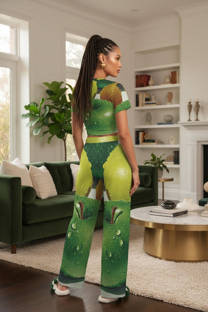 Woman in a green and brown patterned outfit standing in a living room.