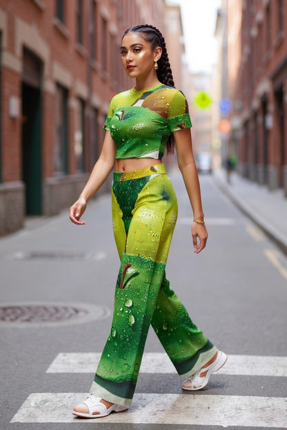 Woman in a green and yellow outfit walking on a city street.