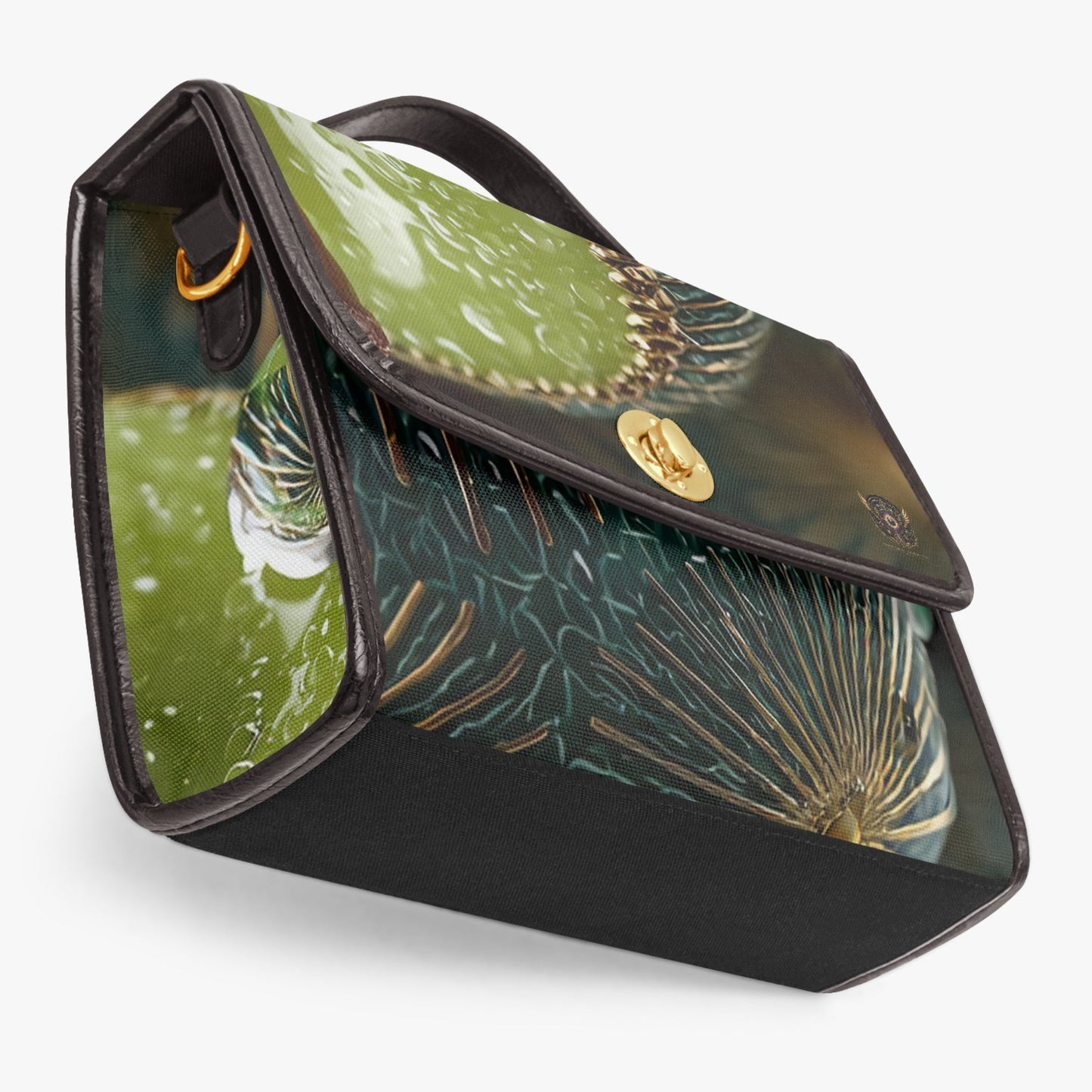 A structured handbag with a glossy green botanical print and black leather trim, featuring a gold-tone turn-lock clasp on a light gray background.
