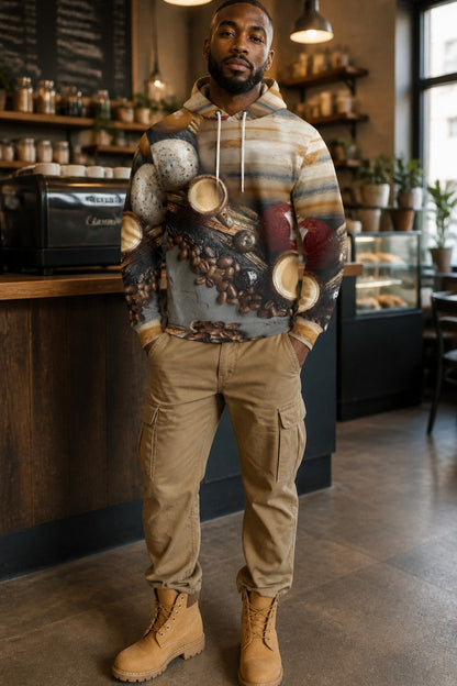 A man wearing a coffee-themed hoodie with a detailed coffee bean and cup graphic, khaki cargo pants, and tan boots, standing inside a cozy cafe environment.