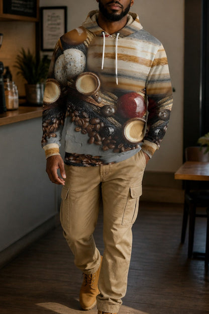A man wearing a graphic hoodie with a coffee-themed print, khaki cargo pants, and tan boots walking inside a coffee shop.