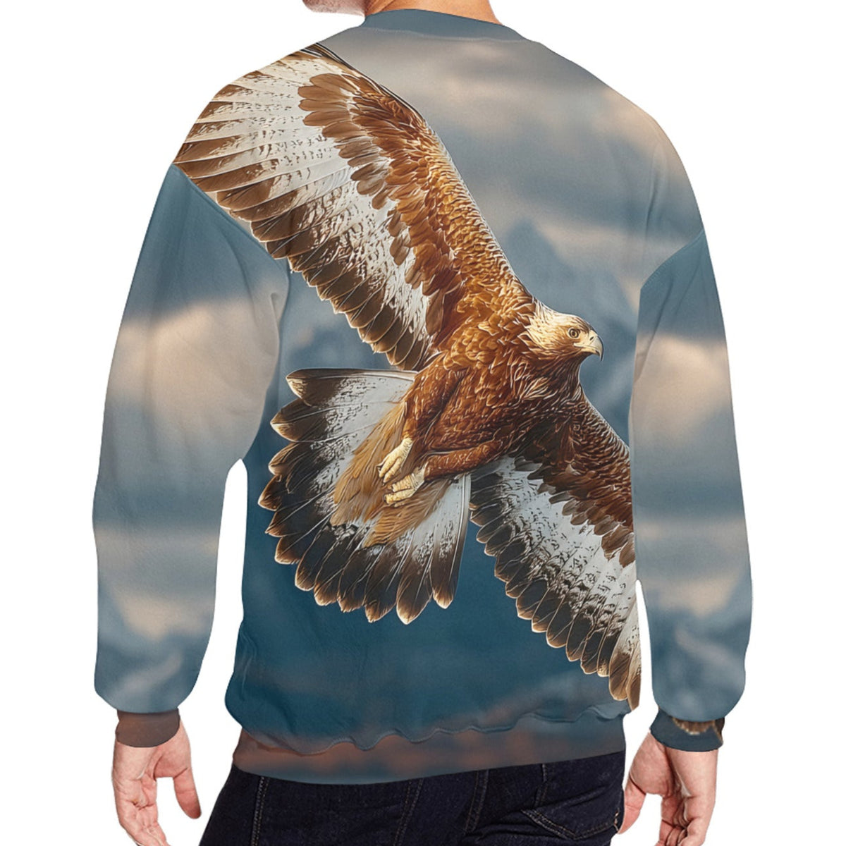 A man shown from the back wearing a crewneck sweatshirt with a large, detailed graphic of a flying eagle on a blue sky background. The sweatshirt is paired with dark jeans against a plain white background.
