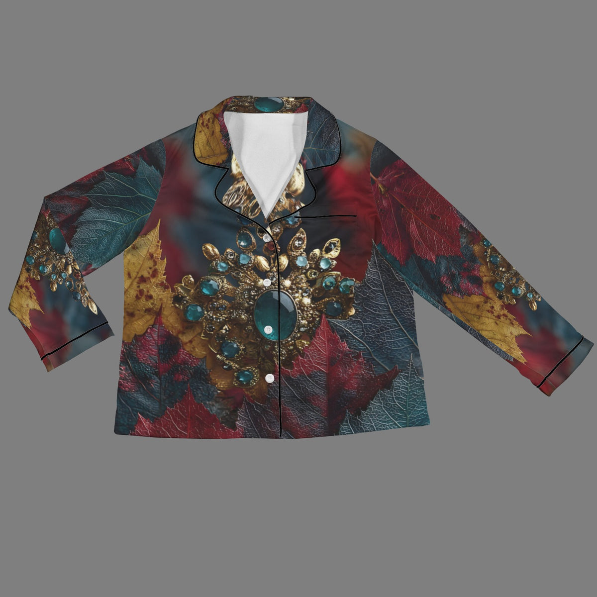 A long-sleeve button-up shirt with a dark, ornate abstract pattern featuring red, teal, gold, and brown leaf-like textures, accented with a large jeweled brooch design on the front and a white inner collar lining.
