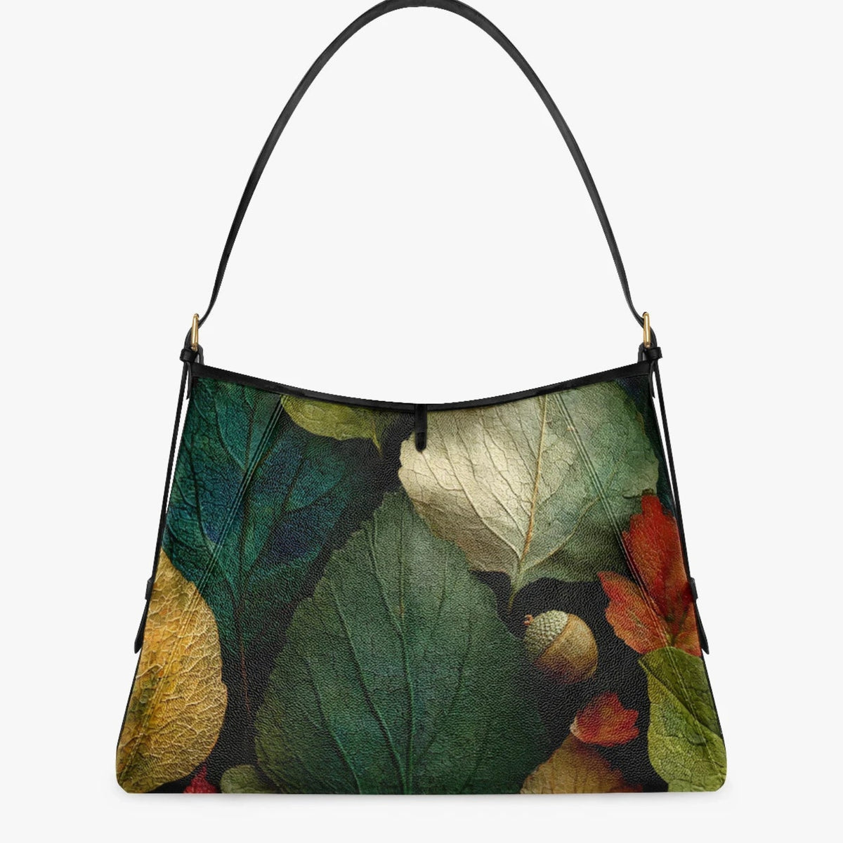 A shoulder bag with a black leather strap and a detailed botanical print of autumn leaves in green, yellow, red, and brown, shown against a plain light gray background.