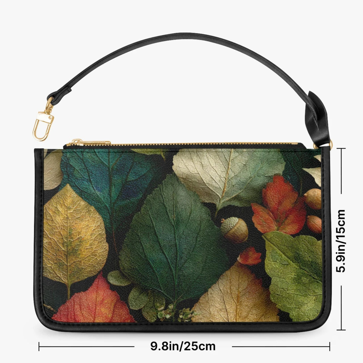 A rectangular clutch or wristlet bag with a black handle and a multicolor autumn leaf print, shown on a light gray background with dimension lines indicating 9.8 in by 5.