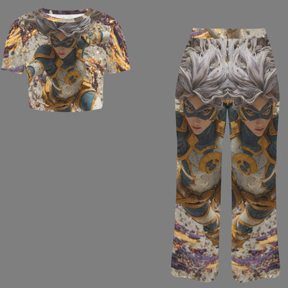 A matching two-piece outfit featuring a short-sleeve crop top and wide-leg pants, both printed with a symmetrical anime-style character design. The character has silver hair, a black mask, and wears gold and blue armor against a textured gray background.