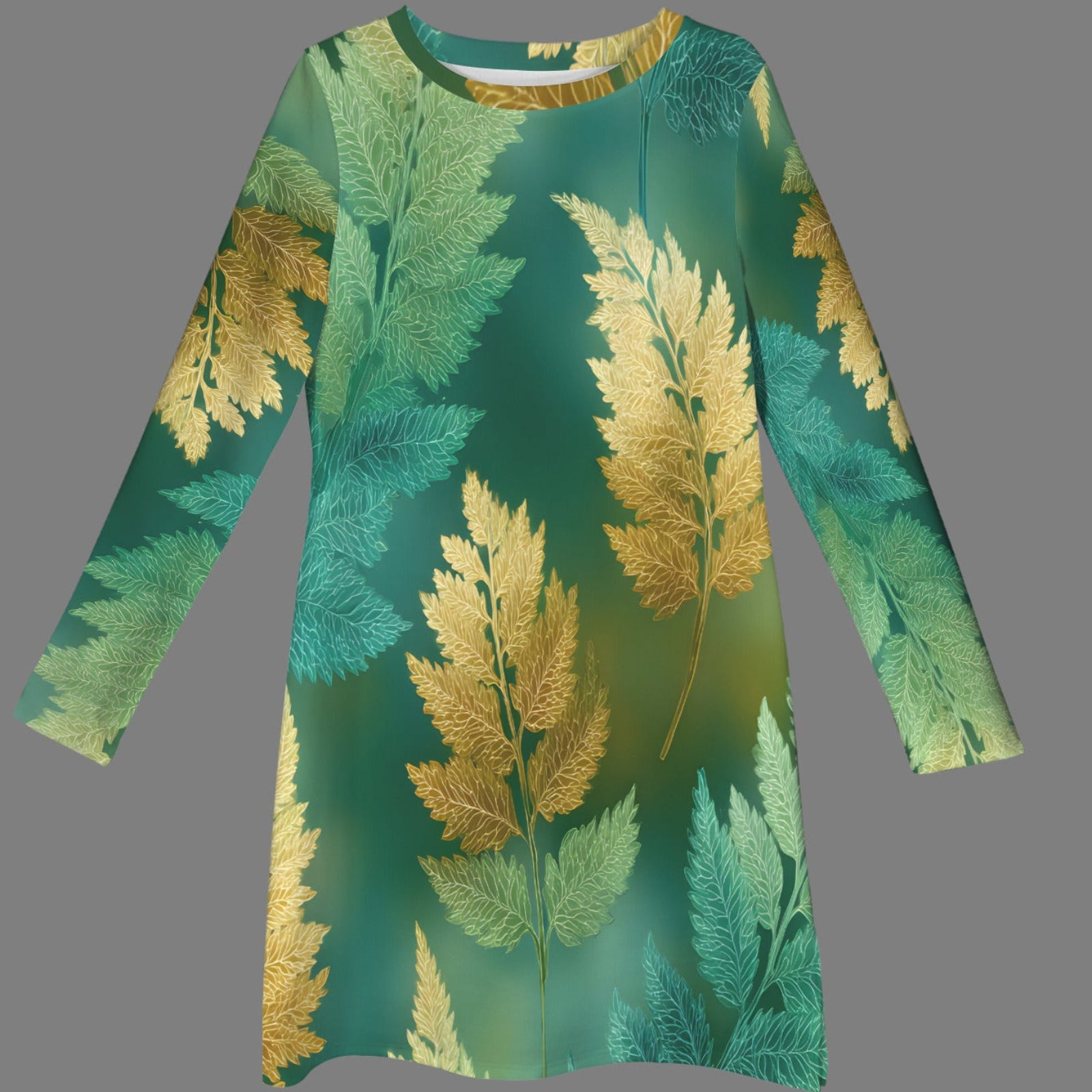 A long-sleeve tunic dress with a green and gold fern leaf pattern, displayed against a solid gray background.