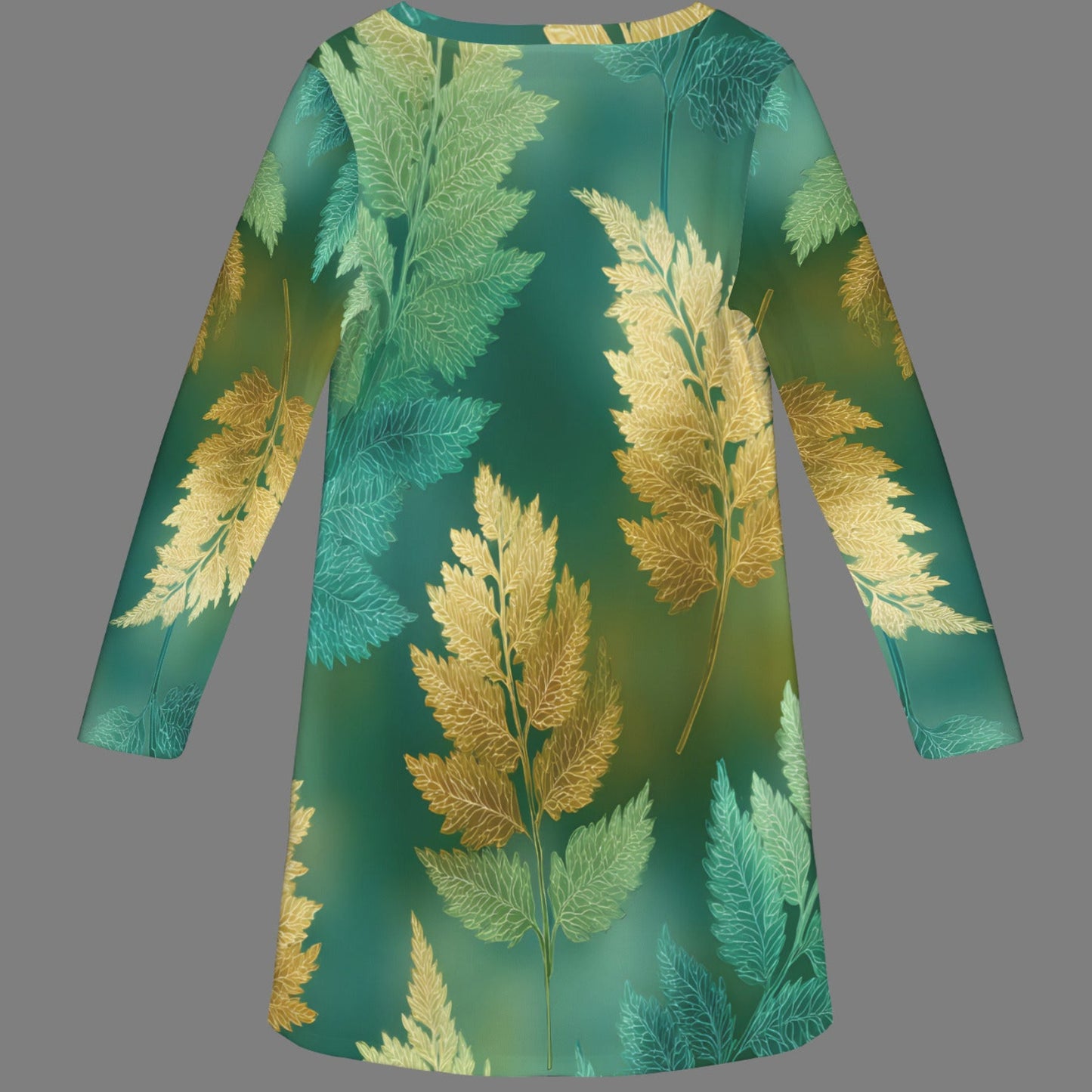 A long-sleeve tunic dress with a green and gold fern leaf pattern, displayed against a solid gray background.