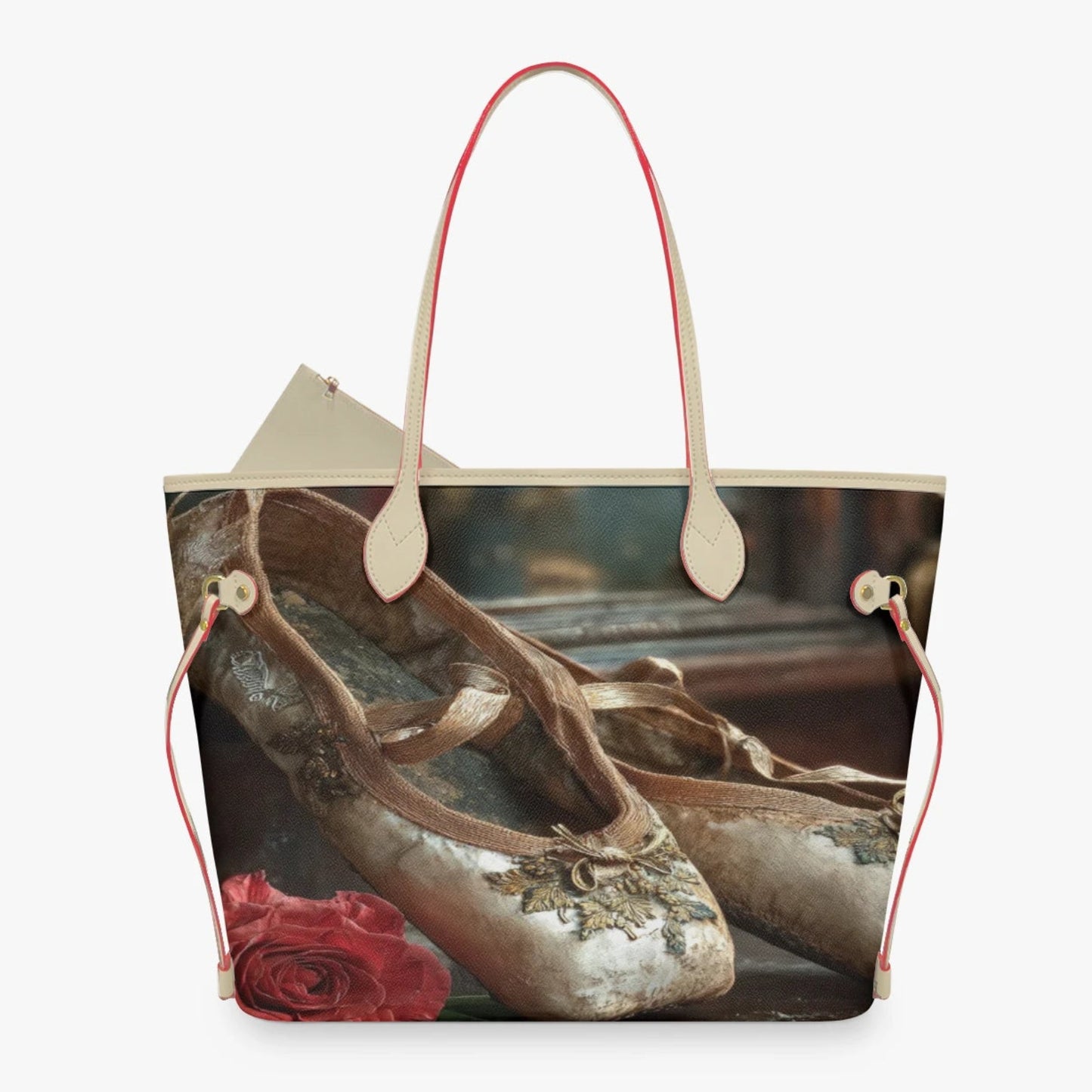 A tote bag featuring a photographic print of vintage ballet pointe shoes and a red rose, with light beige handles and red drawstring side ties, shown against a plain white background.