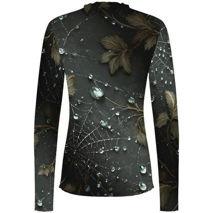 A long-sleeve high-neck top with an all-over print of dark brown leaves, spiderwebs, and clear water droplets on a dark charcoal background, shown against a plain white backdrop.