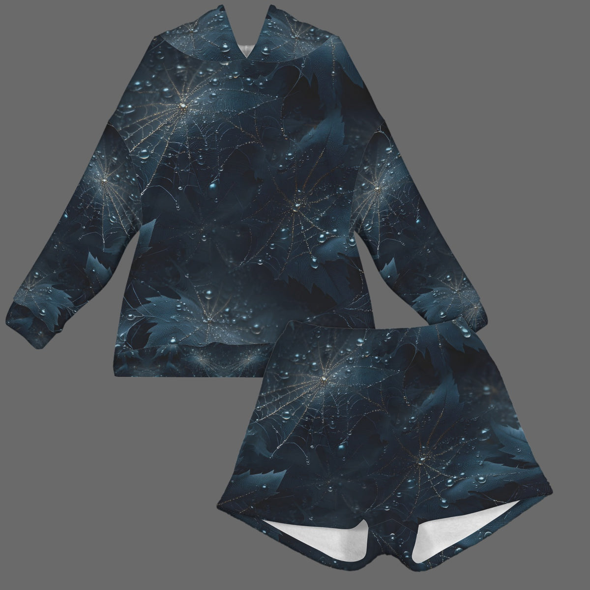 A matching two-piece clothing set consisting of a long-sleeve hooded sweatshirt and shorts, both featuring an all-over abstract cosmic print in dark blue, black, and teal with glowing white starburst patterns, shown on a solid gray background.