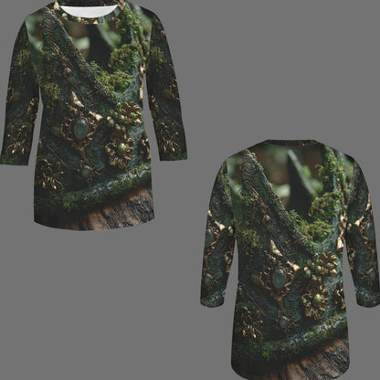 Front and back views of a long-sleeve tunic top featuring an all-over print of mossy green branches and gold floral details on a dark background, displayed against a solid gray backdrop.