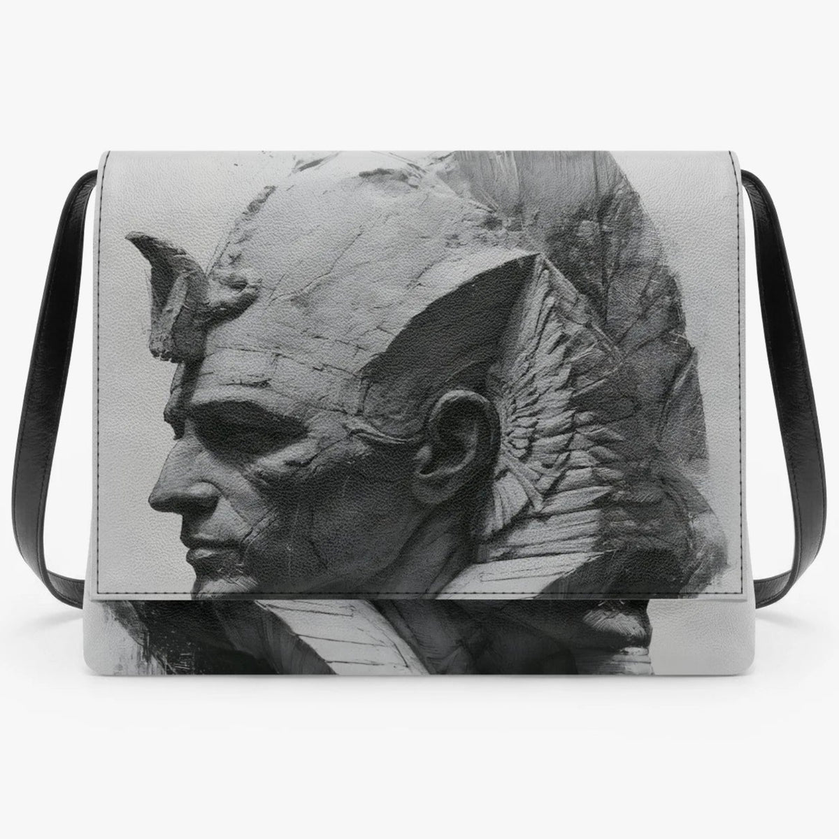A rectangular shoulder bag with a black and white sculptural bust print on the front flap, featuring black shoulder straps and silver-toned metal corner hardware, set against a plain white background.