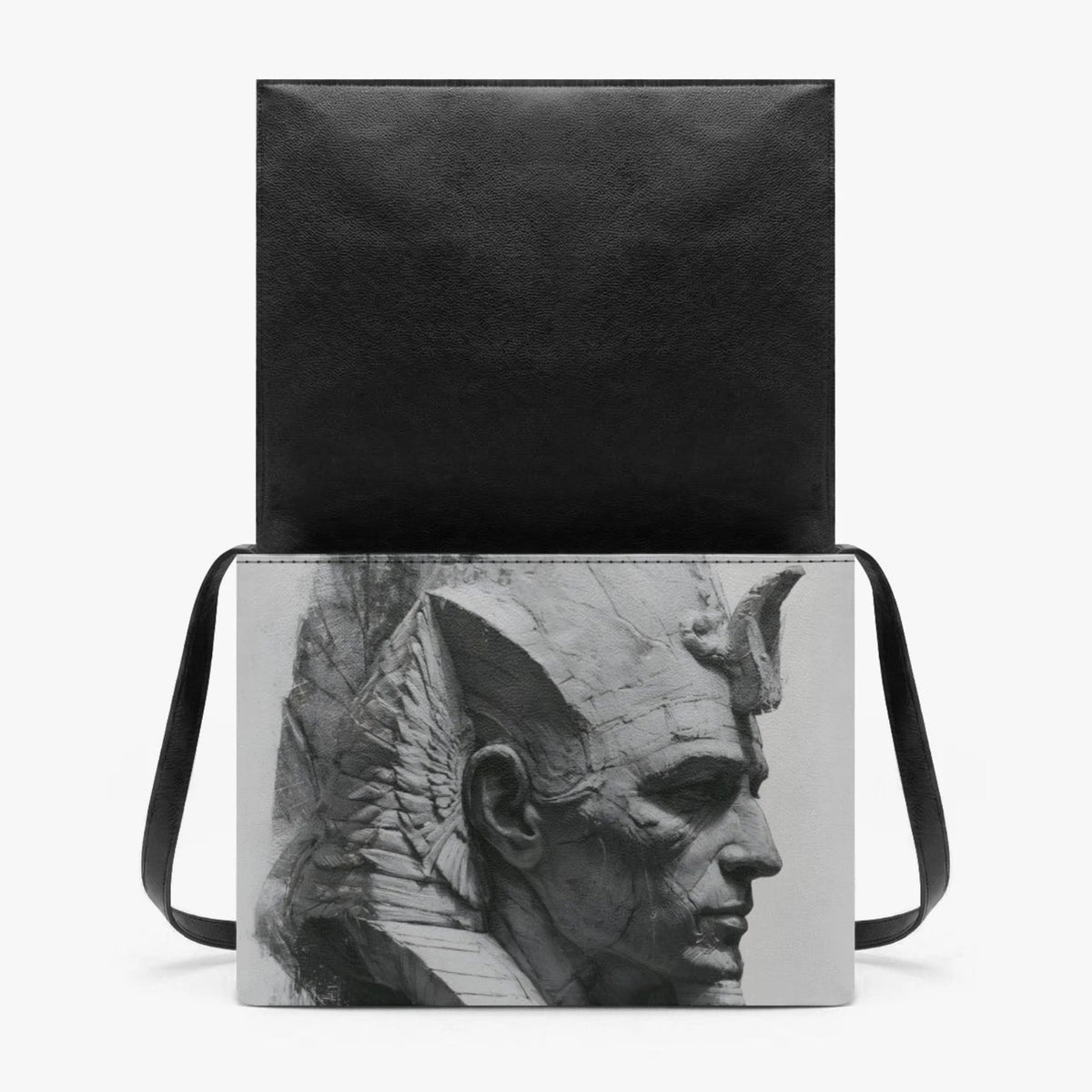 A black shoulder bag with a rectangular black-and-white sculptural bust print on the front, shown against a plain light gray background.