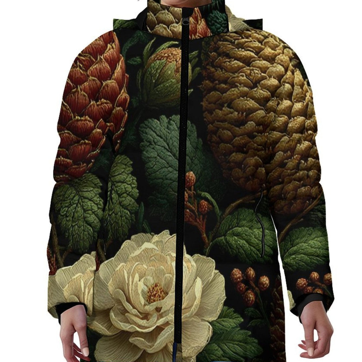 A model wearing a hooded jacket with a detailed botanical print featuring pinecones, artichokes, and a large cream flower on a dark background.