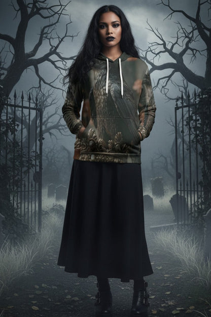 A woman stands in a foggy, gothic cemetery wearing a camouflage-patterned hoodie with white drawstrings and a long black skirt.