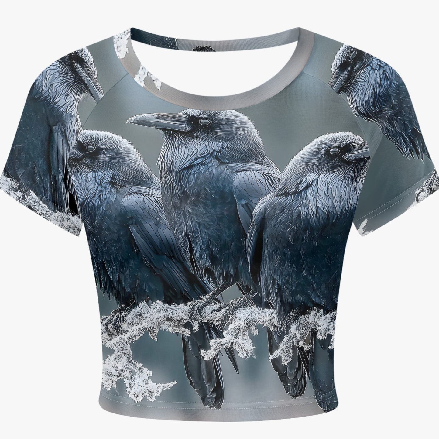 A short-sleeve crop top featuring an all-over print of four black and gray crows perched on branches, shown against a light gray background.