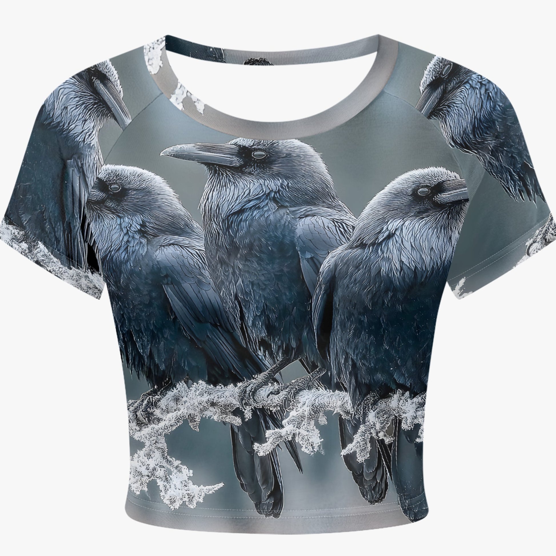A short-sleeve crop top featuring an all-over print of four black and gray crows perched on branches, shown against a light gray background.