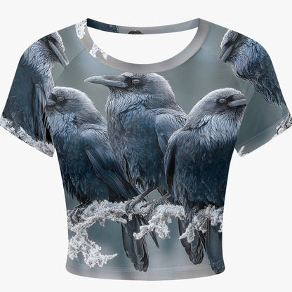 A short-sleeve crop top featuring an all-over print of four black and gray crows perched on branches, shown against a light gray background.
