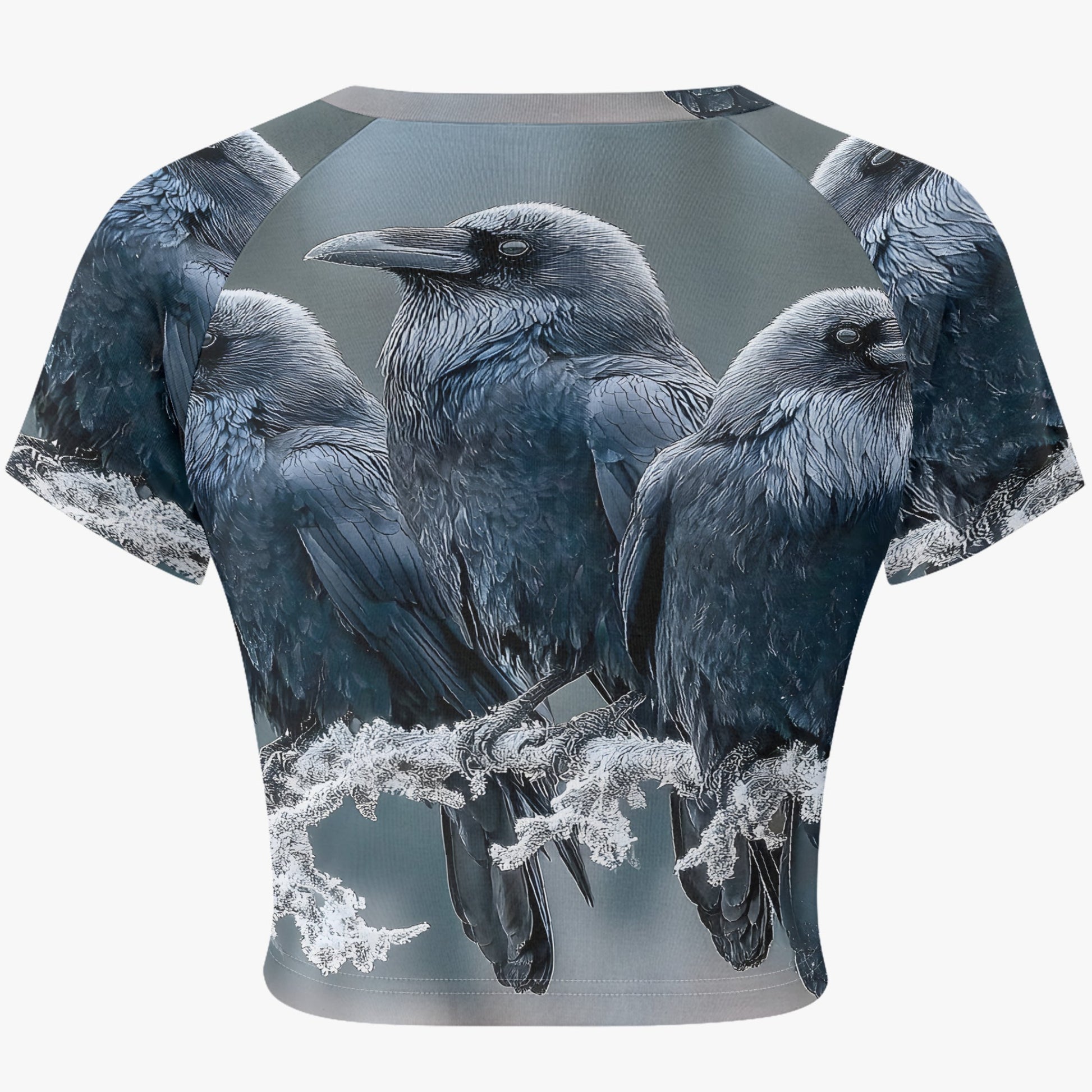 A short-sleeve crop top featuring an all-over graphic print of four black and gray crows perched on frosted branches, shown against a plain white background.