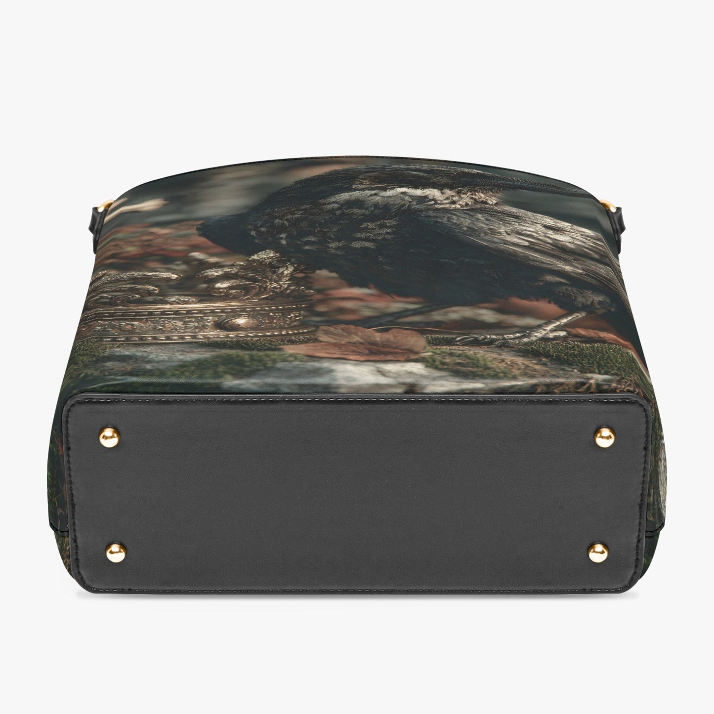 A structured handbag shown from the back, featuring a black leather base with gold-tone rivets and a printed top panel depicting a scenic landscape with dark mountains and green water.