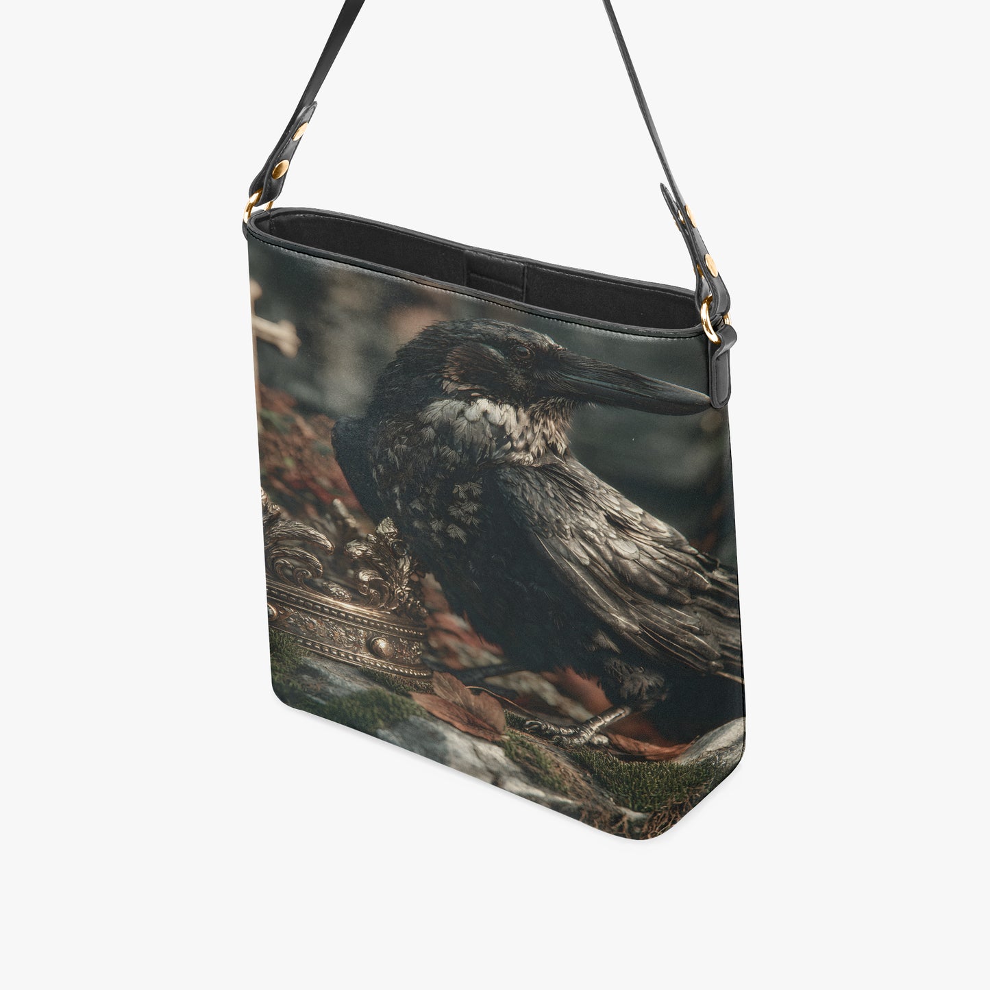 A black shoulder bag featuring a detailed photographic print of a crow or raven perched on a branch, shown against a plain light gray background.