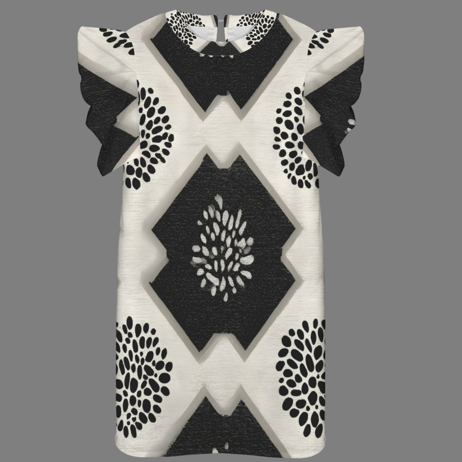 A short-sleeve knit top with a black and off-white geometric pattern, featuring ruffled sleeves and a central diamond motif, shown against a solid gray background.