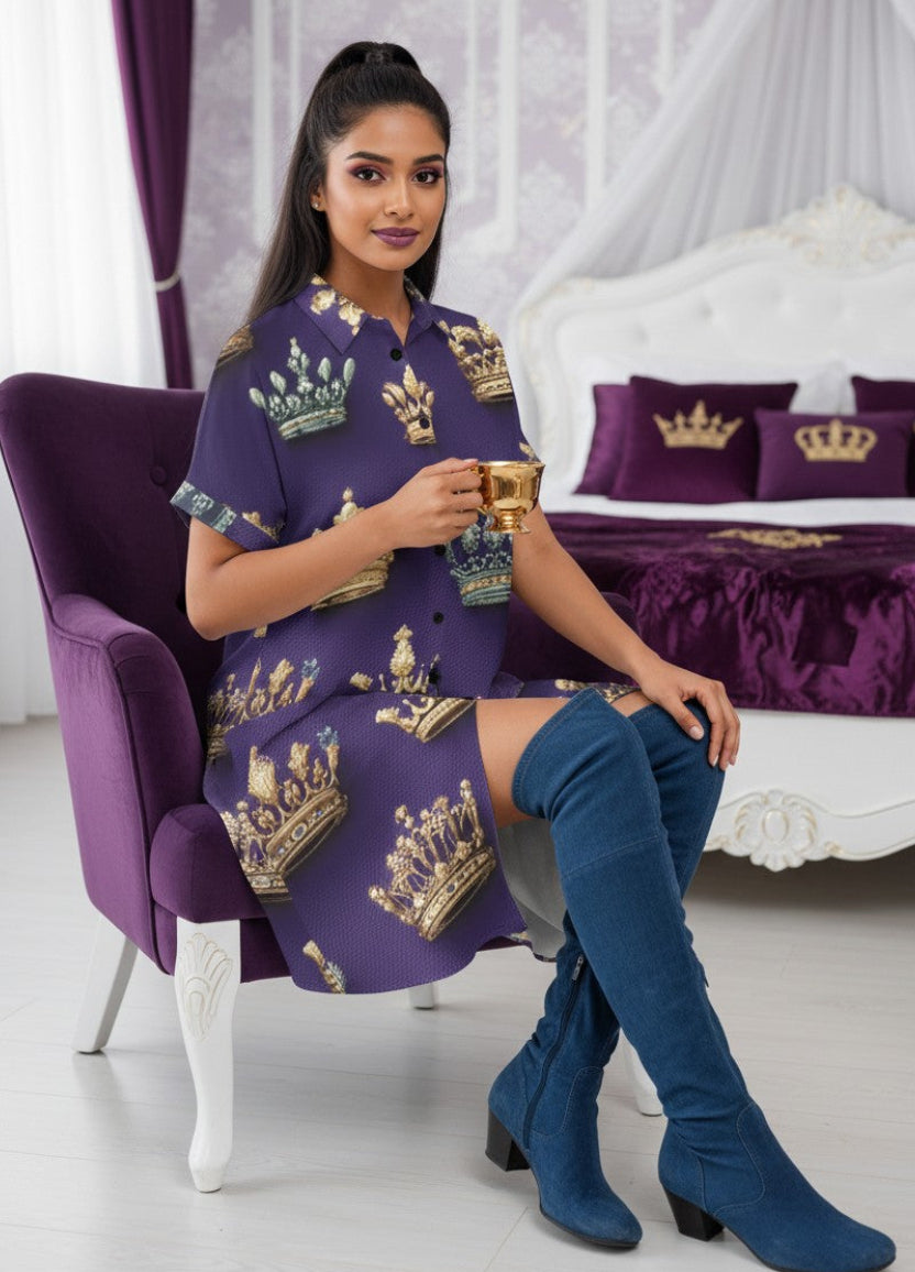 A woman in a button up shirt dress in her royal themed bedroom