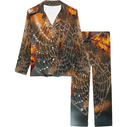 A matching two-piece pajama set featuring a long-sleeve button-up shirt and pants, both printed with a detailed pattern of spiderwebs, dewy leaves, and autumn foliage in warm brown, orange, and gray tones.