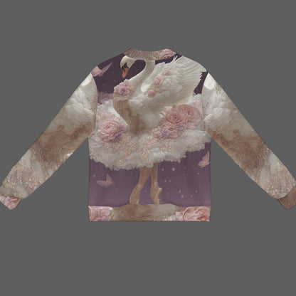A long-sleeve crewneck sweatshirt featuring an all-over fantasy print of a white swan ballerina surrounded by pink roses on a purple and beige background, displayed on a solid dark gray backdrop.