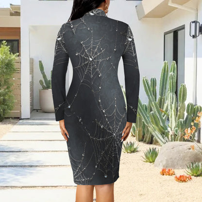 A woman wearing a black long-sleeve mock-neck dress with a white spiderweb and dewy gem print, shown from the back in an outdoor patio setting with cacti.