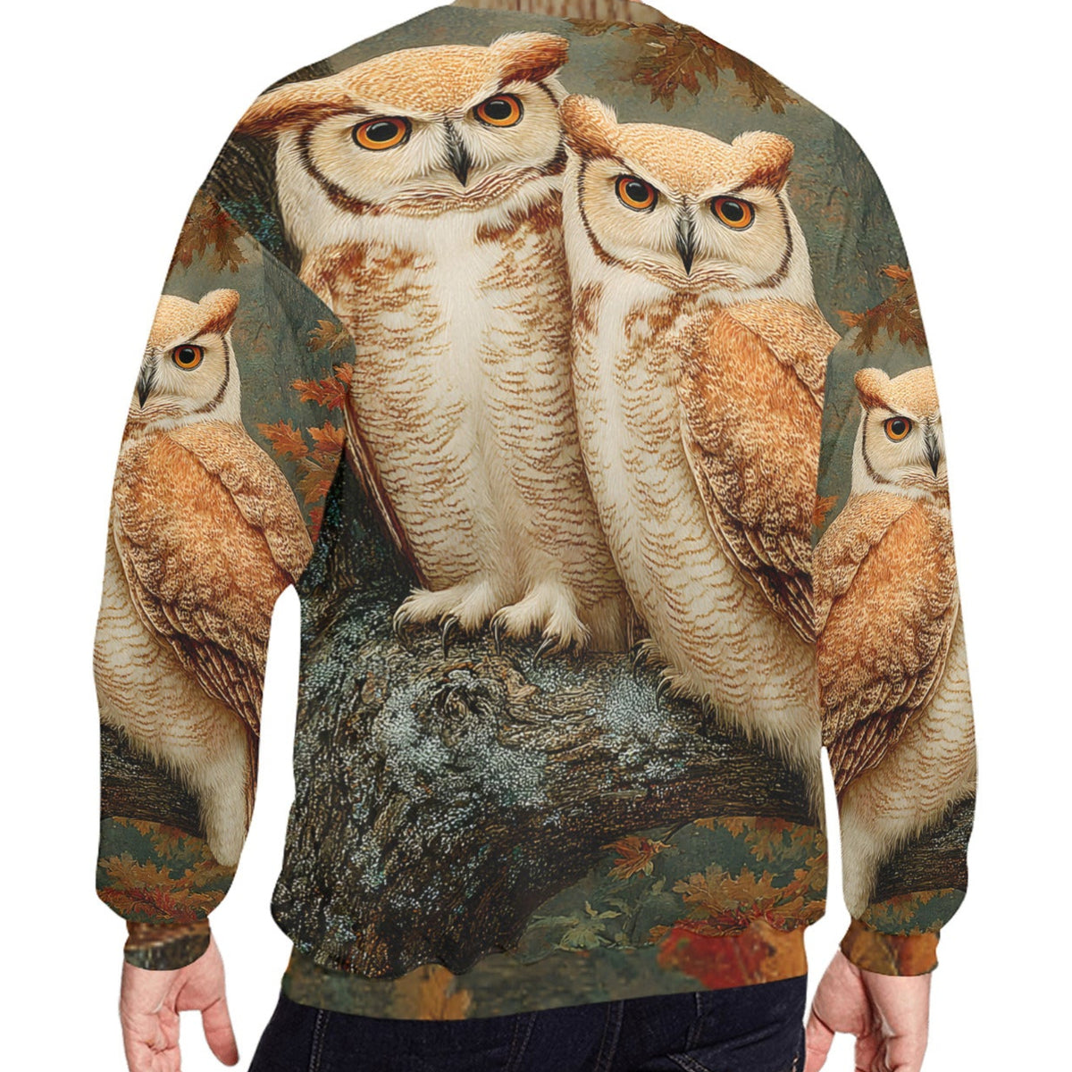 A man wearing a crewneck sweatshirt from the back, featuring a detailed all-over print of four great horned owls perched on a tree branch with autumn leaves.